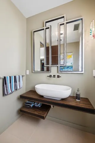 a living room with furniture and a dining table