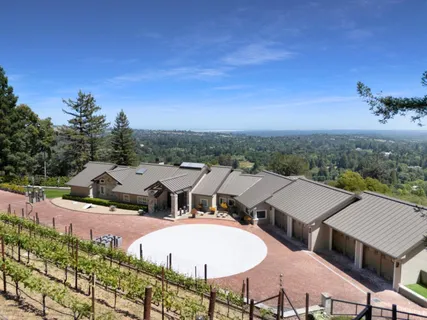 a front view of a house with a yard table and chairs