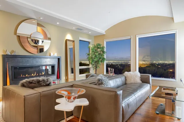 a aerial view of a house with swimming pool and a yard
