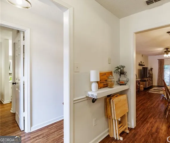 a room with furniture and wooden floor