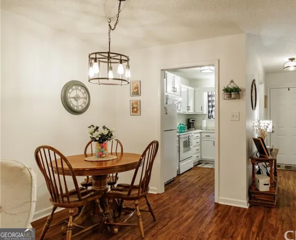 a view of a dining room with furniture wooden floor and a table