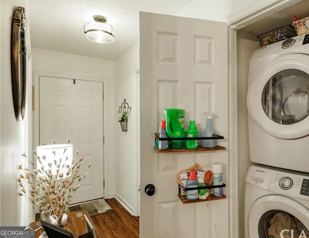 a bedroom with bed and wooden floor