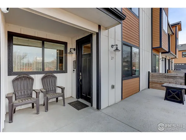 a balcony with furniture and a gate