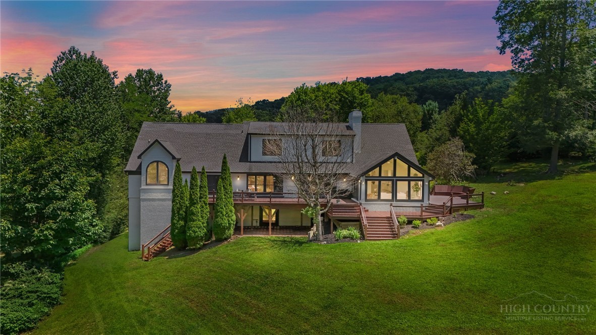 140 Wilson Ridge Road Boone, NC 28607 - Photo 2 of 48 a front view of a house with a yard and green space