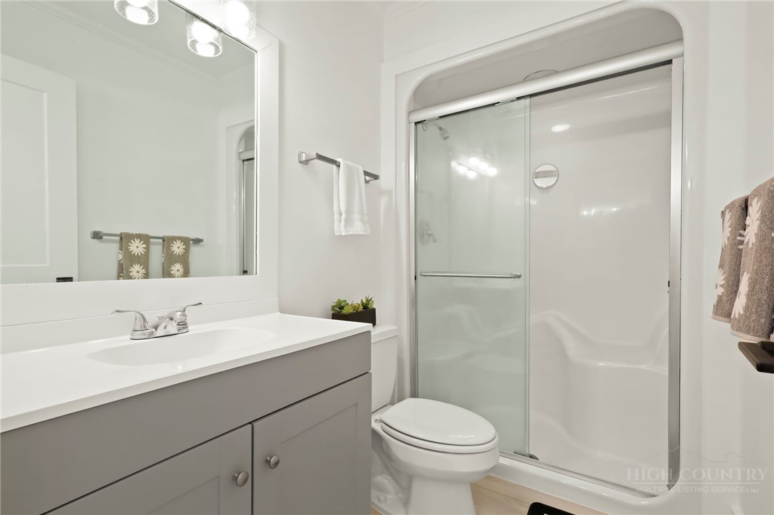 140 Wilson Ridge Road Boone, NC 28607 - Photo 38 of 48 a bathroom with a sink toilet and shower