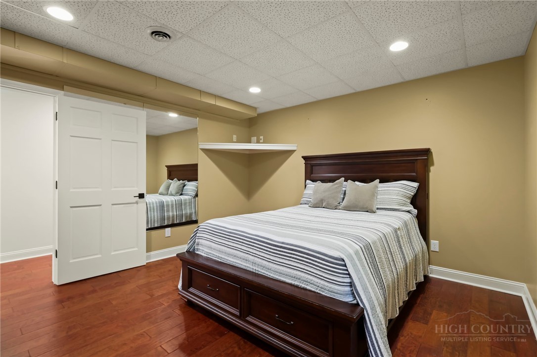 140 Wilson Ridge Road Boone, NC 28607 - Photo 43 of 48 a bedroom with a bed and a view of closet