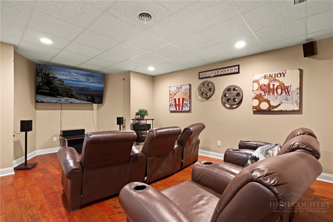 140 Wilson Ridge Road Boone, NC 28607 - Photo 45 of 48 a media room with lots of chairs and a projector