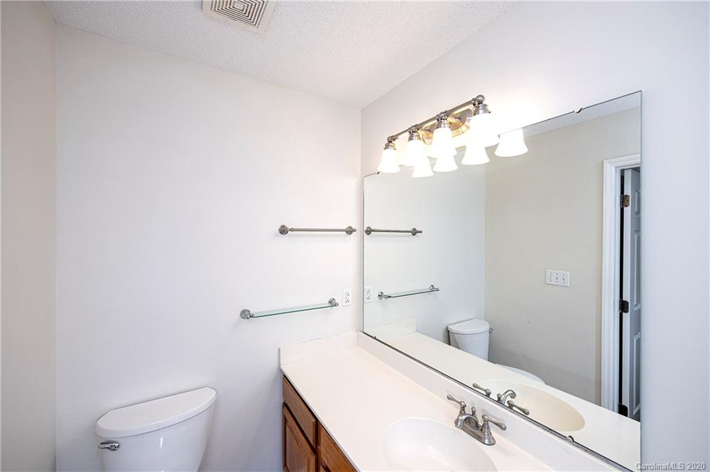 5003 Sharon Road, Unit R Charlotte, NC 28210 - Photo 17 of 23 a bathroom with a sink a toilet and shower
