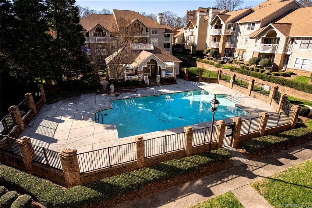 5003 Sharon Road, Unit R Charlotte, NC 28210 - Photo 21 of 23 a view of multiple houses with yard