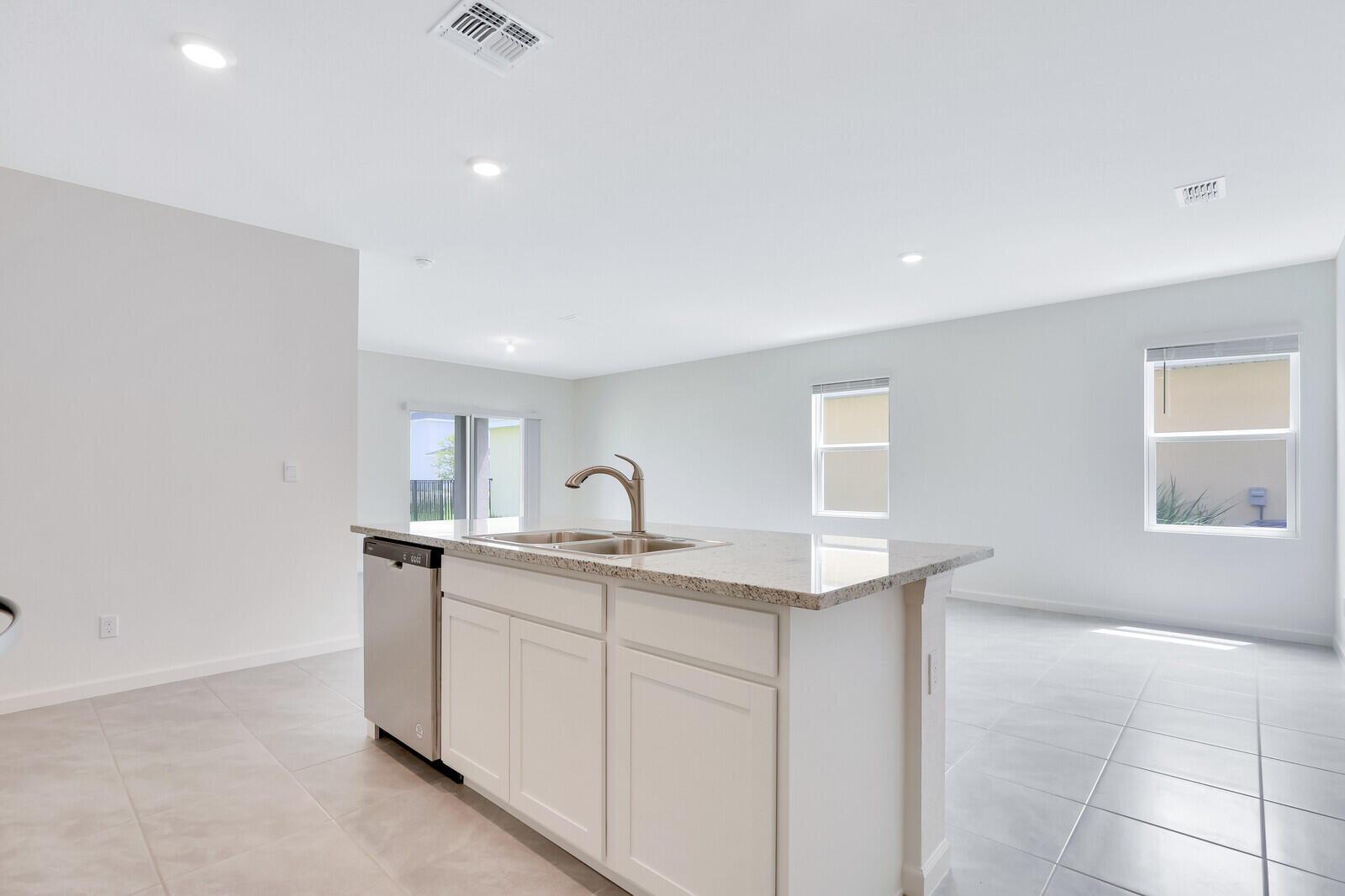 12335 Southwest Nettuno Way Port Port St. Lucie, FL 34987 - Photo 14 of 33 a kitchen with sink and cabinets
