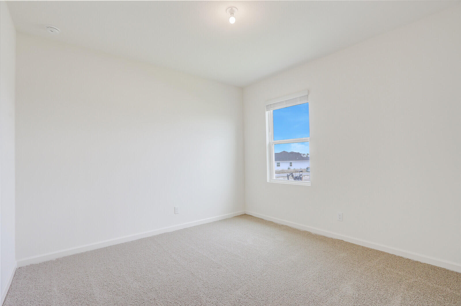 12335 Southwest Nettuno Way Port Port St. Lucie, FL 34987 - Photo 20 of 33 a view of an empty room and a window