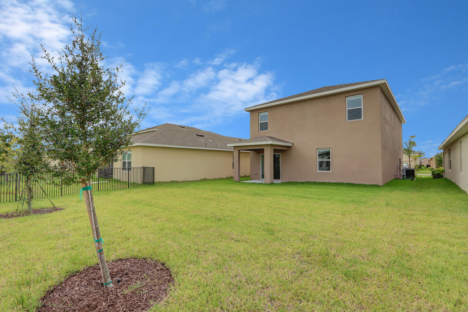 12335 Southwest Nettuno Way Port Port St. Lucie, FL 34987 - Photo 32 of 33 a view of a backyard of the house
