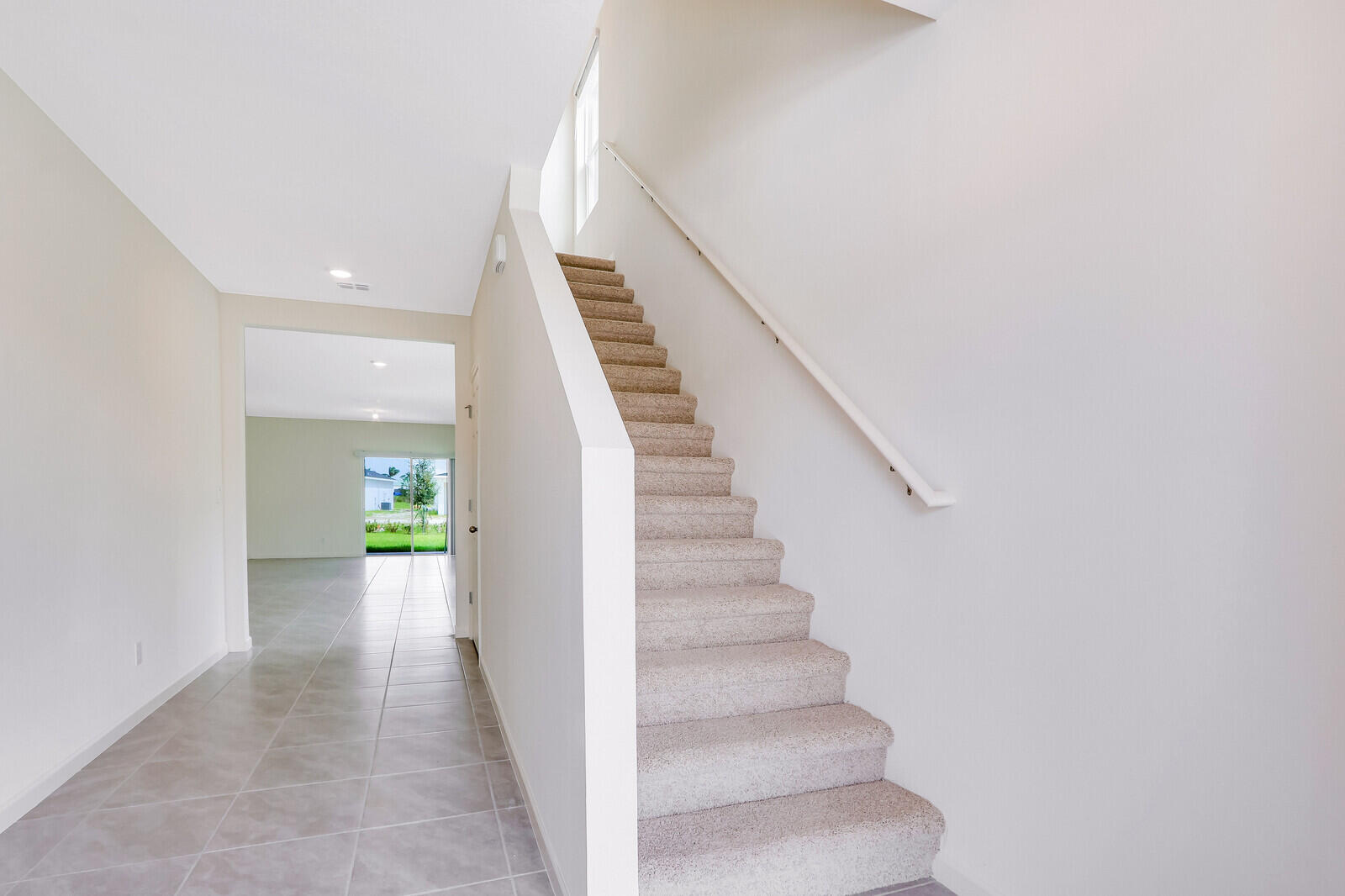 12335 Southwest Nettuno Way Port Port St. Lucie, FL 34987 - Photo 4 of 33 a view of entryway and hall with wooden floor