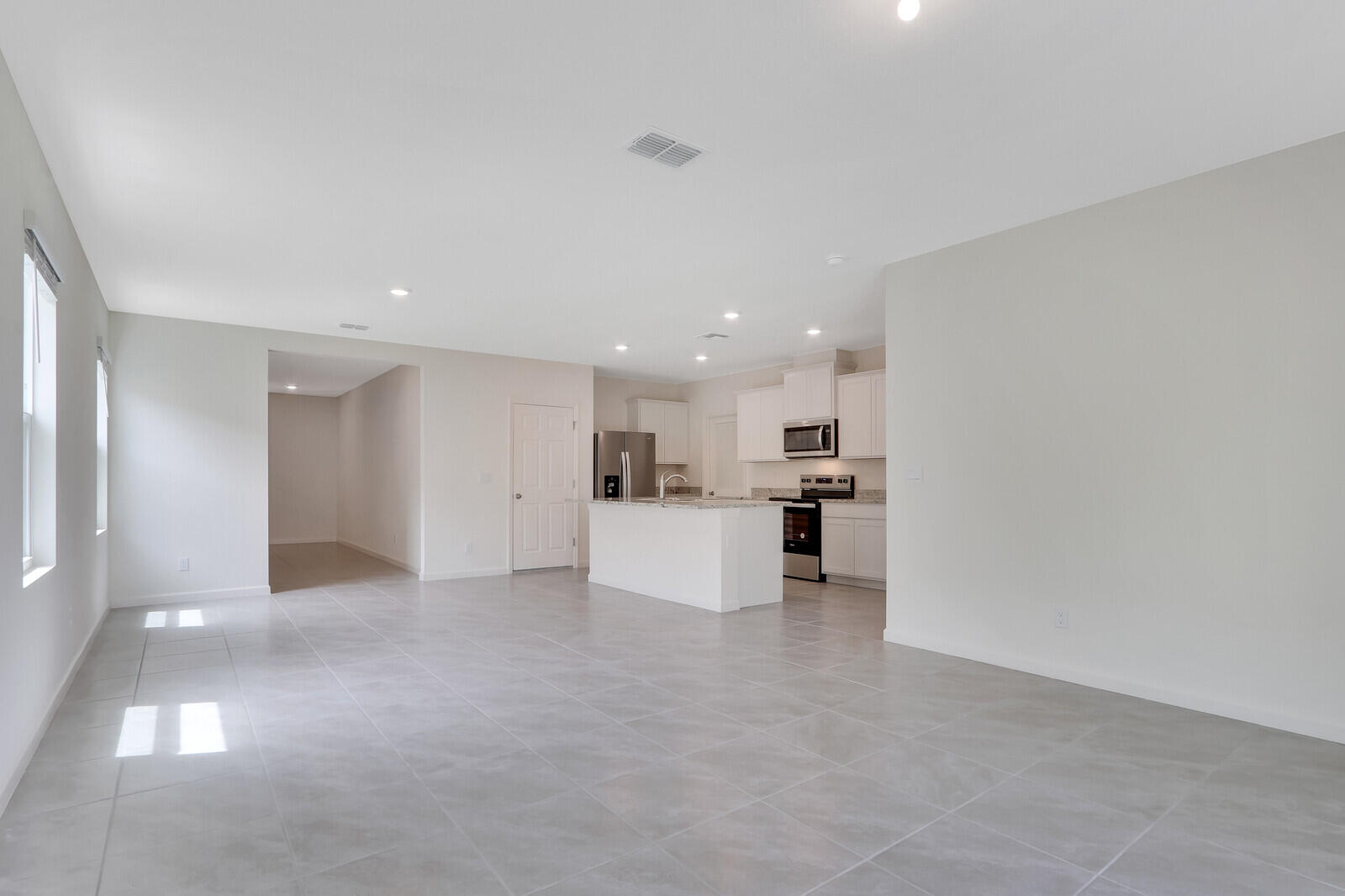 12335 Southwest Nettuno Way Port Port St. Lucie, FL 34987 - Photo 9 of 33 a view of a kitchen with a sink and cabinets