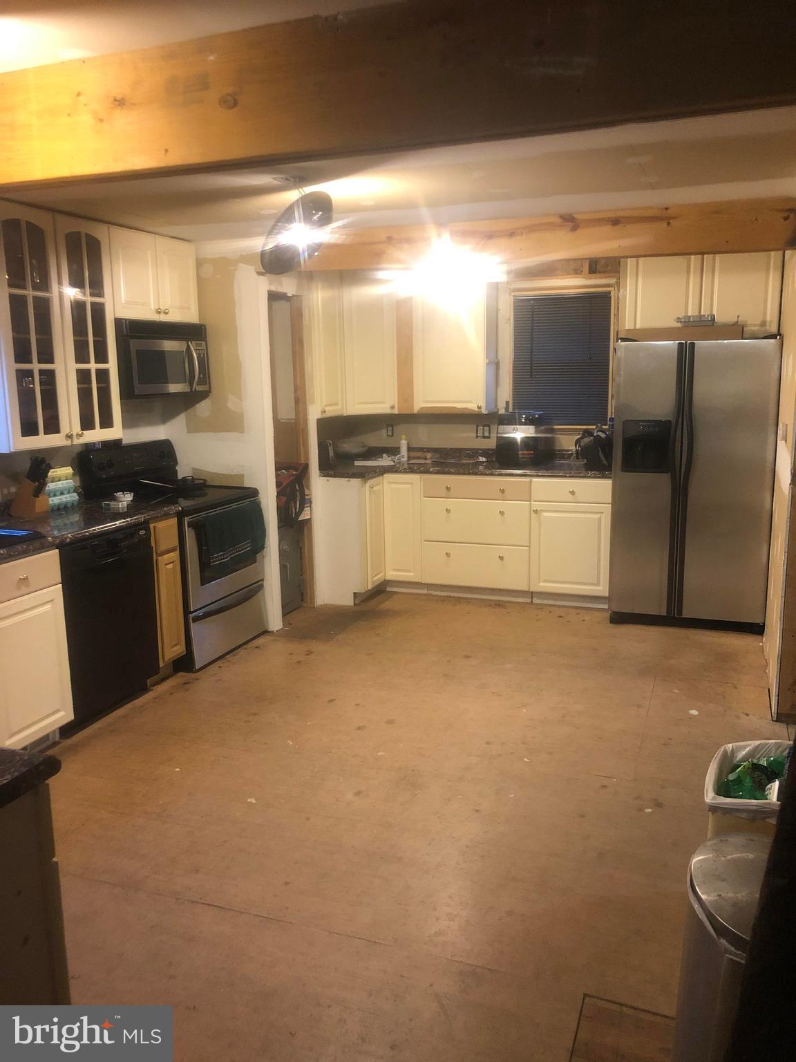 422 Bull Run Road Wrightsville, PA 17368 - Photo 4 of 46 a large kitchen with a large counter top space a stove and stainless steel appliances