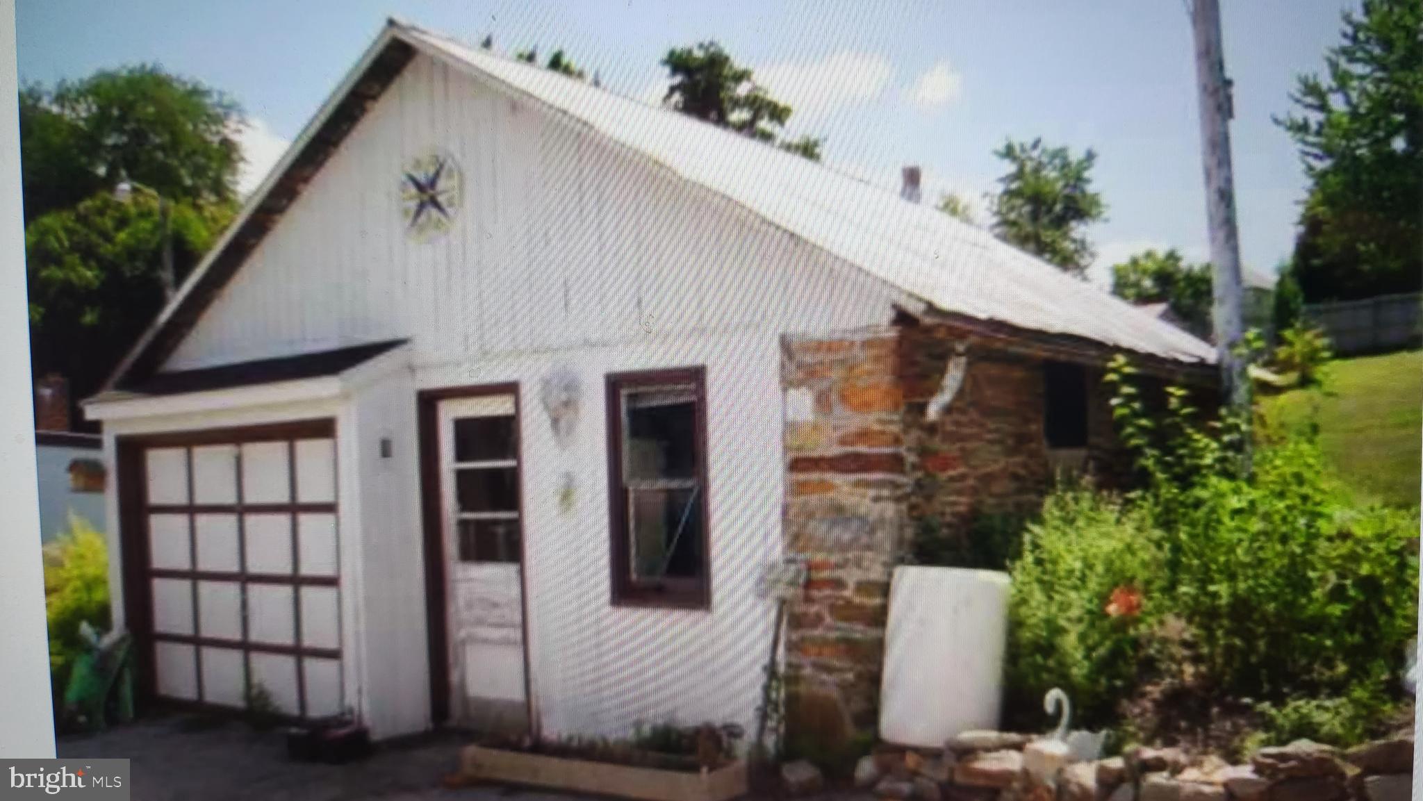 422 Bull Run Road Wrightsville, PA 17368 - Photo 41 of 46 a front view of a house with a plants