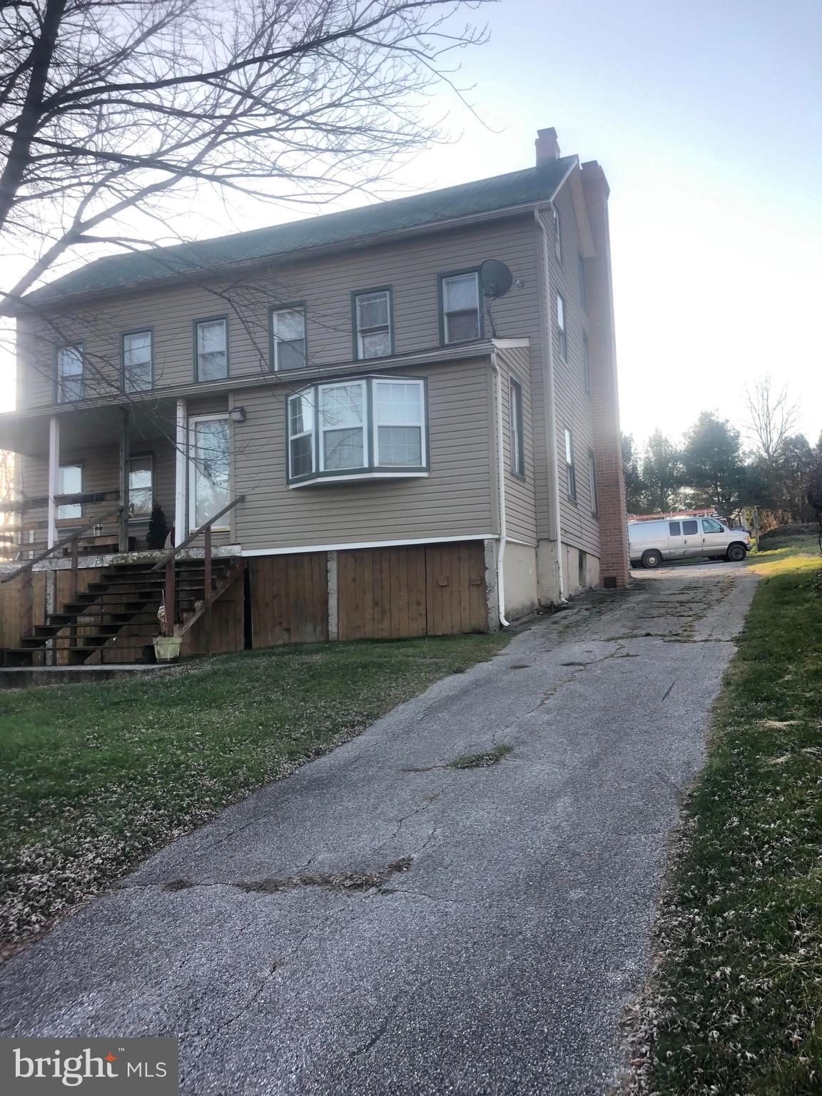 422 Bull Run Road Wrightsville, PA 17368 - Photo 46 of 46 a front view of a house with a yard and garage