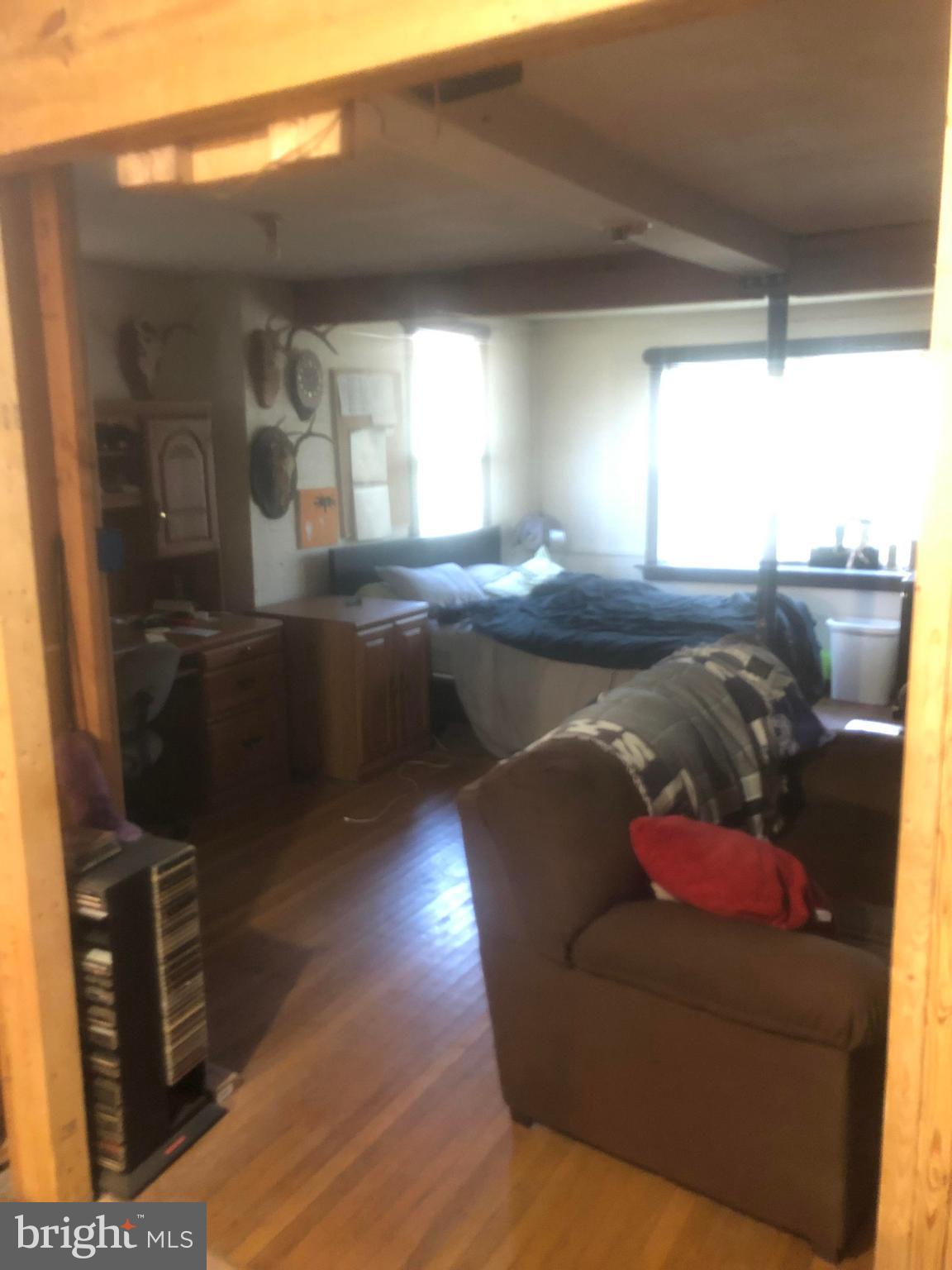 422 Bull Run Road Wrightsville, PA 17368 - Photo 5 of 46 a living room with furniture and a flat screen tv