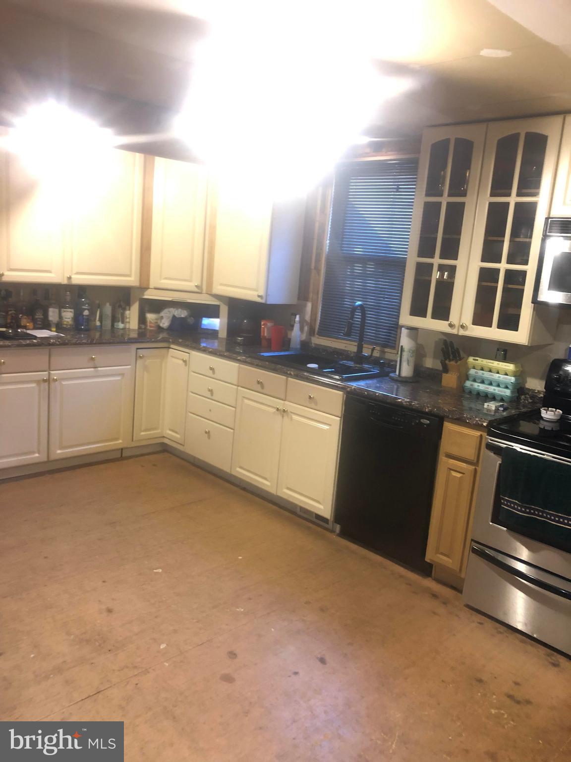 422 Bull Run Road Wrightsville, PA 17368 - Photo 10 of 46 a kitchen with stainless steel appliances granite countertop a stove a sink and a microwave