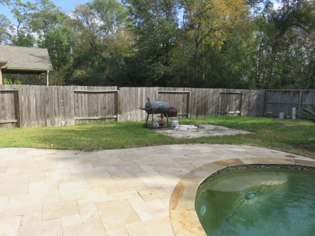 2607 Alan Lake Lane Spring, TX 77388 - Photo 35 of 42 a swimming pool with wooden fence