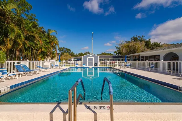 a view of a swimming pool with a patio