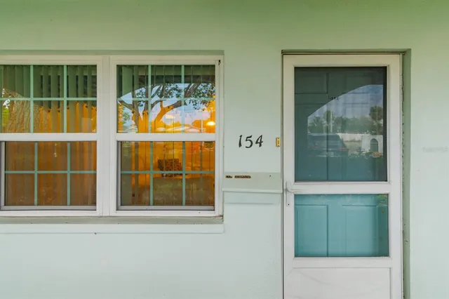 front view of a house with a large window