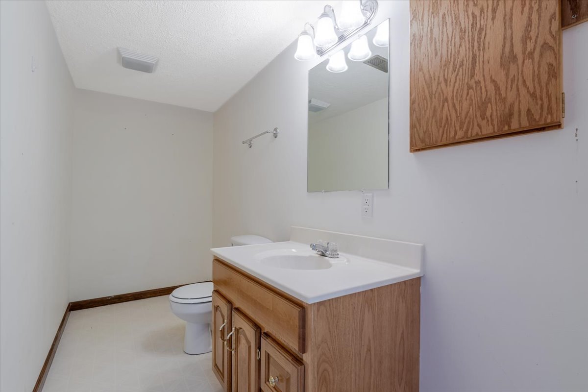 516 Wild Turkey Lane Normal, IL 61761 - Photo 20 of 26 a bathroom with a sink vanity and toilet