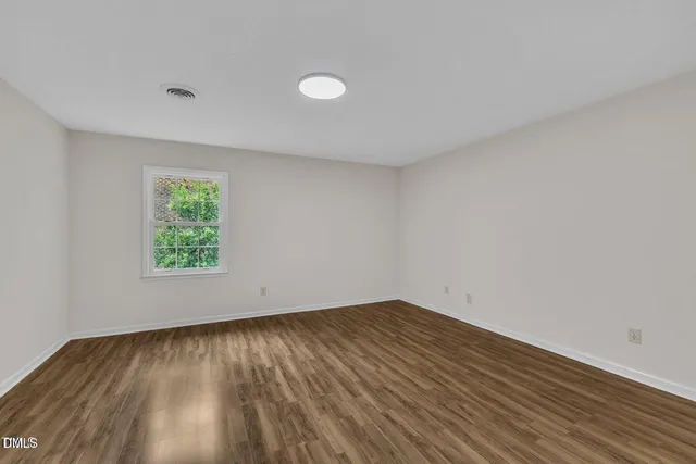 a view of an empty room and window