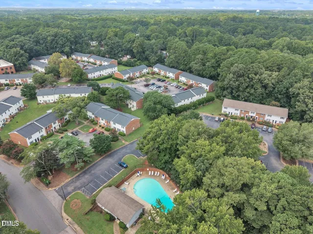 an aerial view of residential house with outdoor space and swimming pool