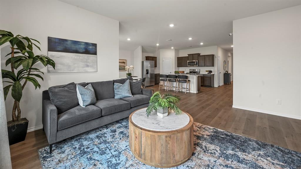 3264 Spaulding Drive Paris, TX 75460 - Photo 30 of 33 a living room with furniture and a view of kitchen