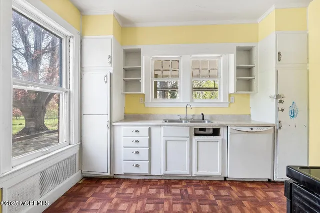 a kitchen with granite countertop a stove and a sink