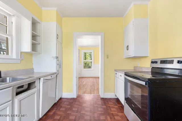 a kitchen with stainless steel appliances granite countertop a stove and a refrigerator