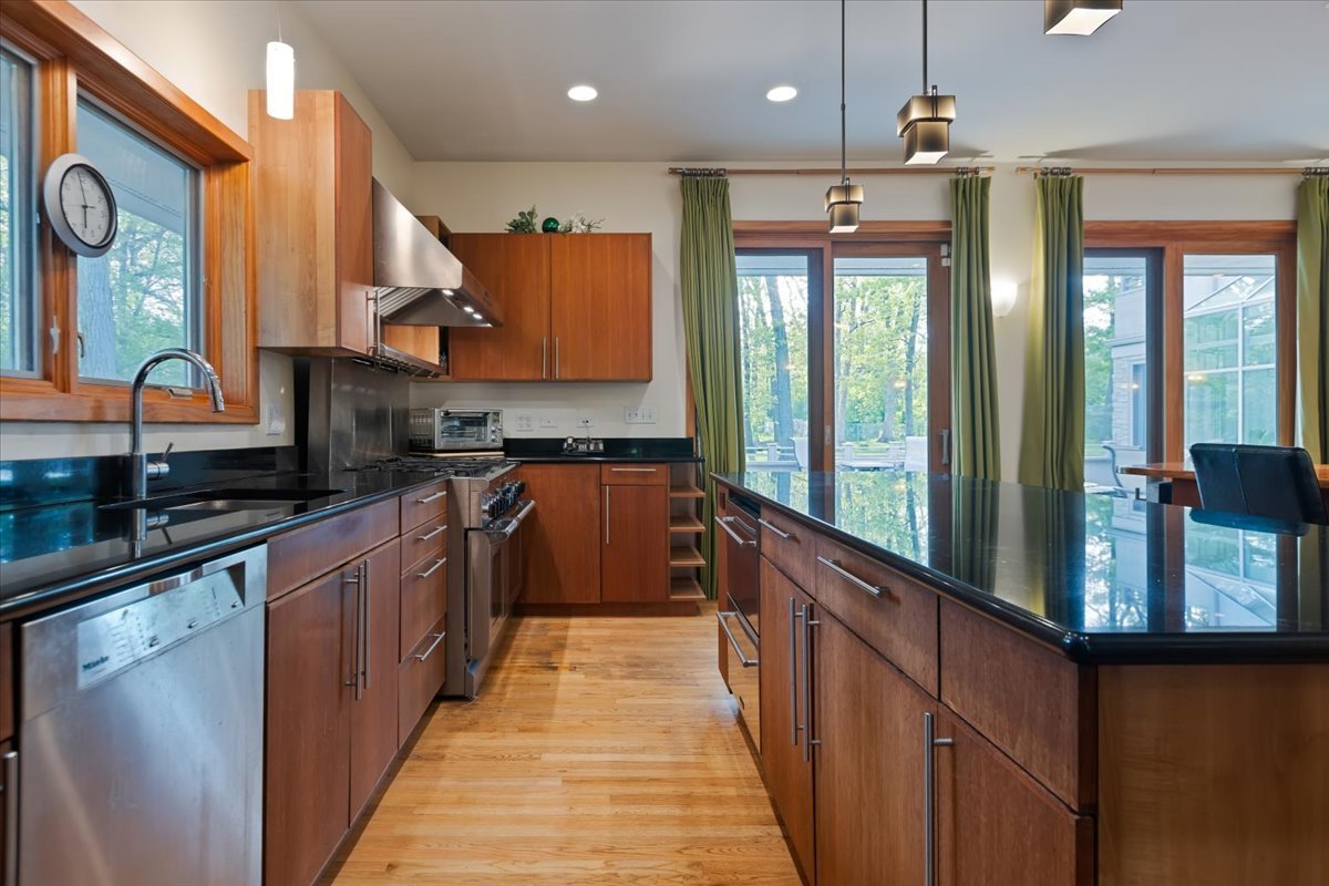 3464 Old Mill Road North Highland Park, IL 60035 - Photo 15 of 64 a kitchen with stainless steel appliances granite countertop a stove a sink and a refrigerator