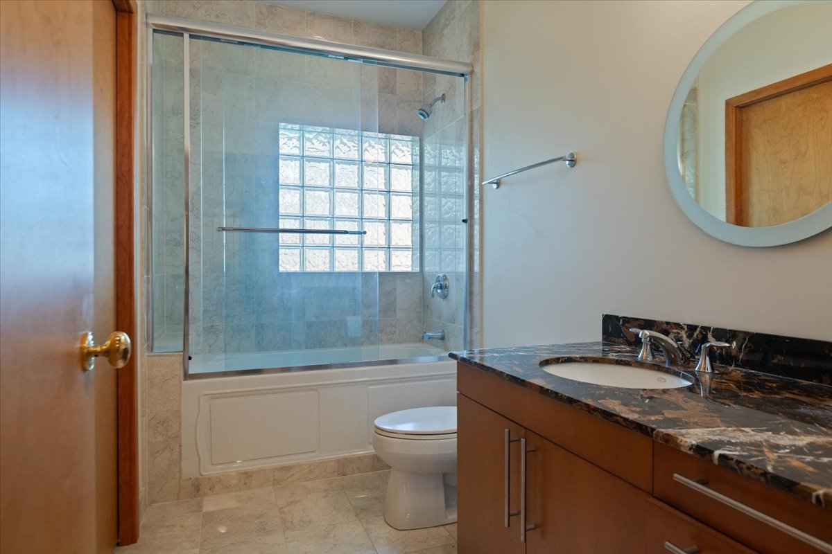 3464 Old Mill Road North Highland Park, IL 60035 - Photo 34 of 64 a bathroom with a granite countertop sink toilet and shower