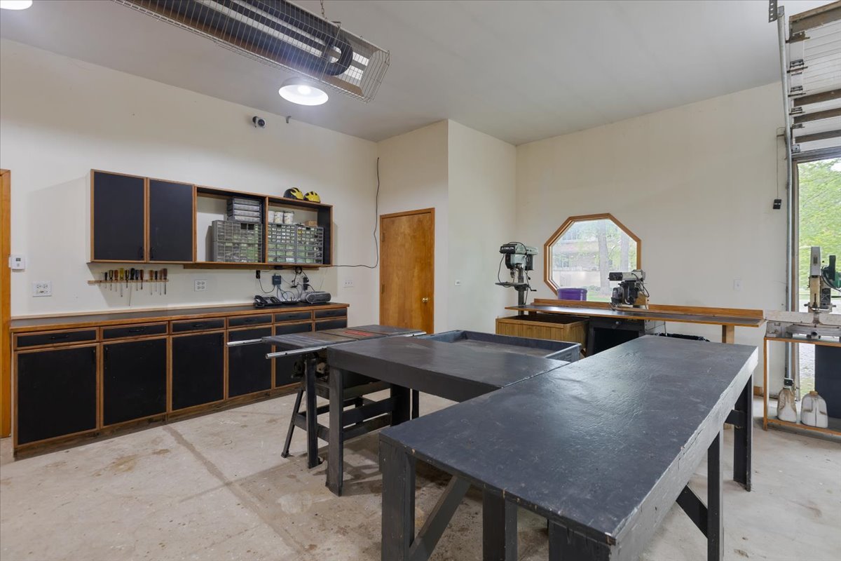 3464 Old Mill Road North Highland Park, IL 60035 - Photo 51 of 64 a kitchen with a table chairs microwave and cabinets