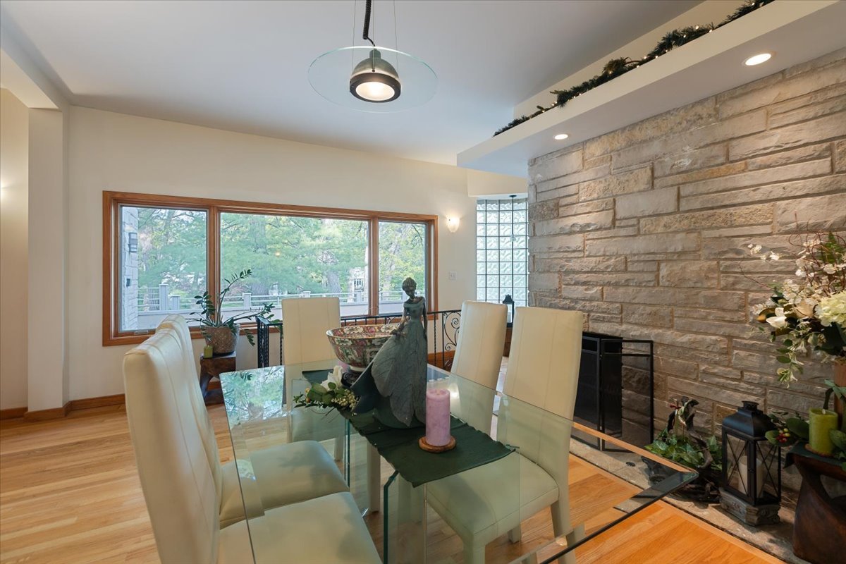 3464 Old Mill Road North Highland Park, IL 60035 - Photo 9 of 64 a living room with fireplace furniture and a floor to ceiling window