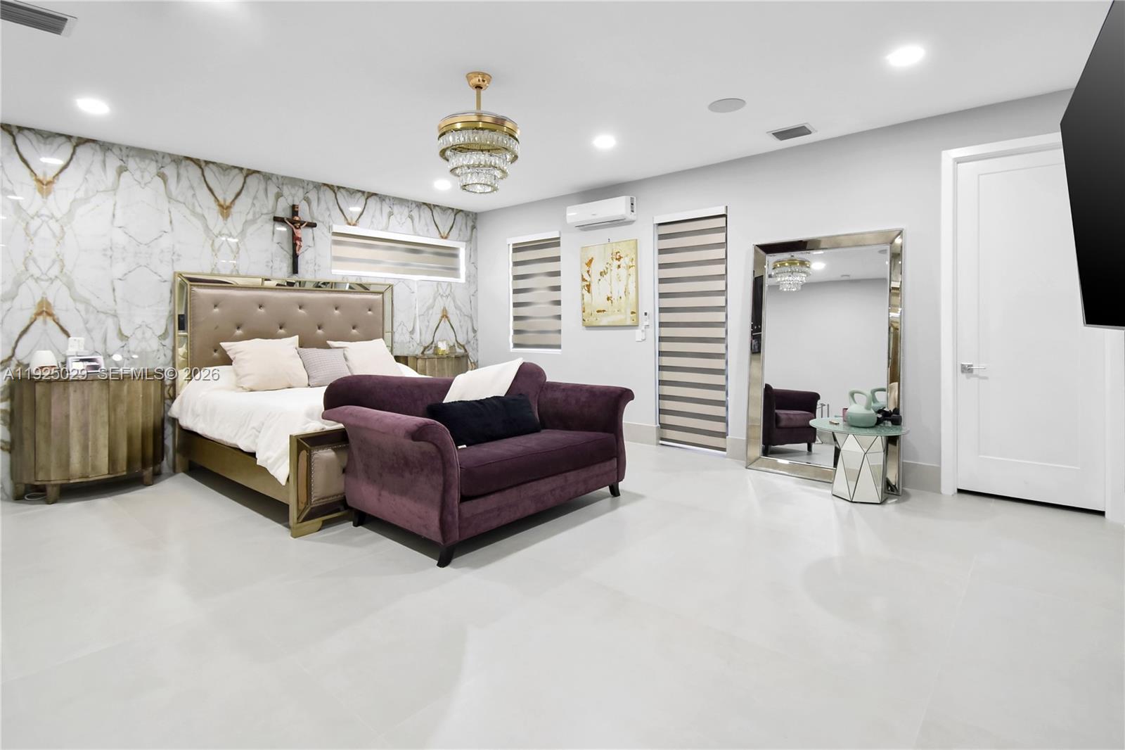 15846 Southwest 49th Street Southwest Ranches, FL 33331 - Photo 13 of 38 a living room with furniture and a chandelier