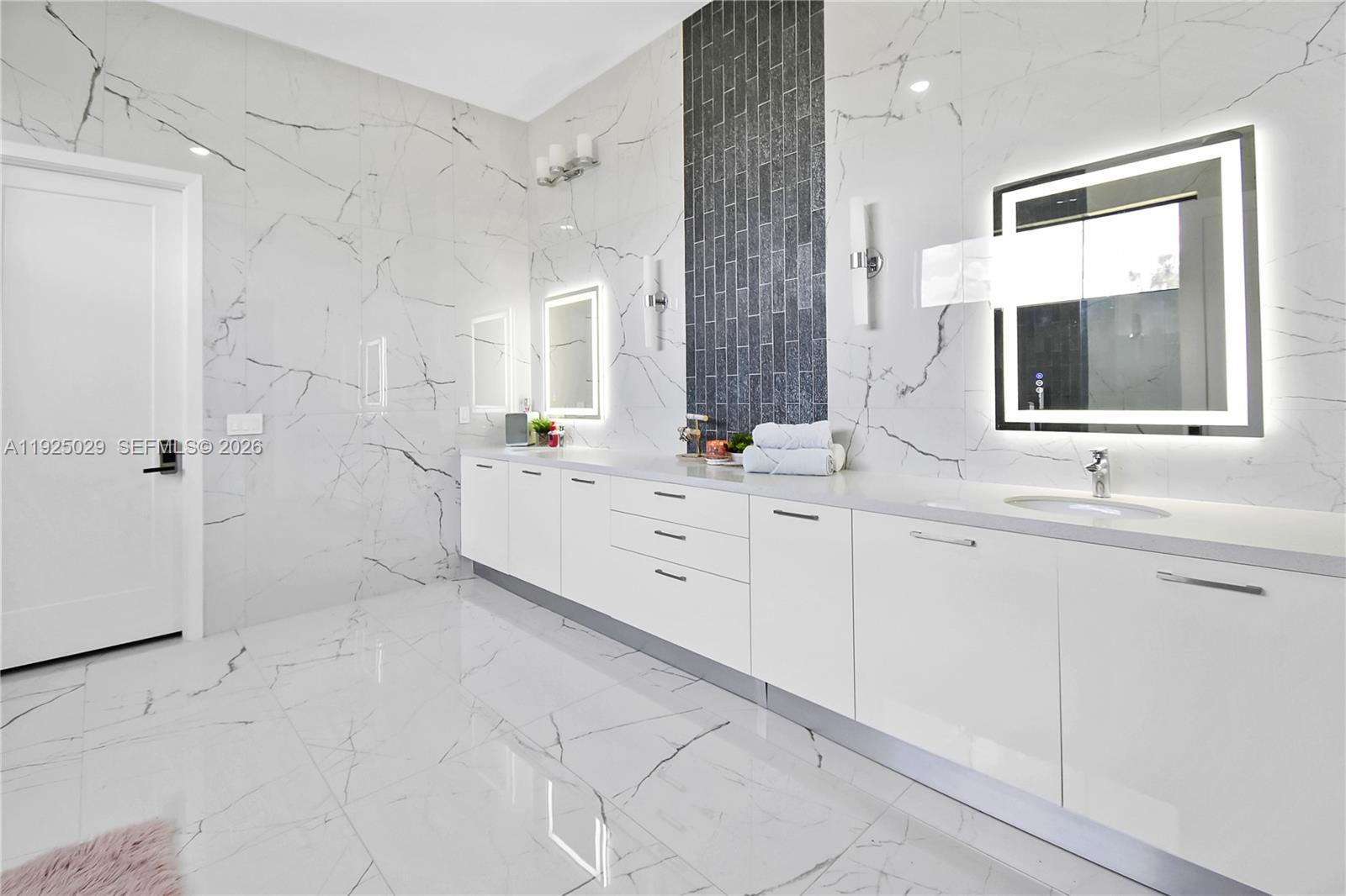 15846 Southwest 49th Street Southwest Ranches, FL 33331 - Photo 20 of 38 a bathroom with a double vanity sink a mirror and a