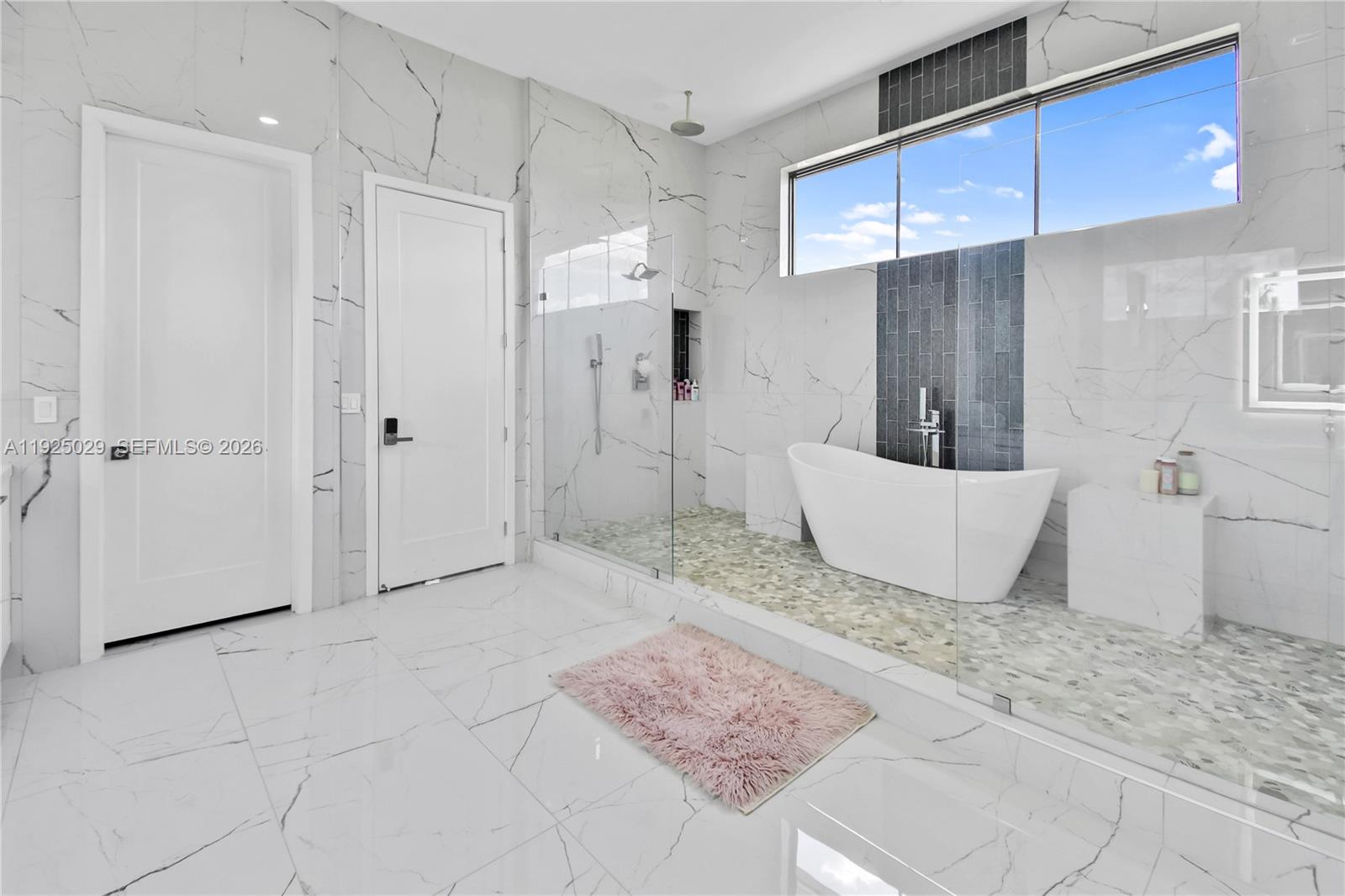 15846 Southwest 49th Street Southwest Ranches, FL 33331 - Photo 22 of 38 a spacious bathroom with a granite countertop sink a toilet and shower