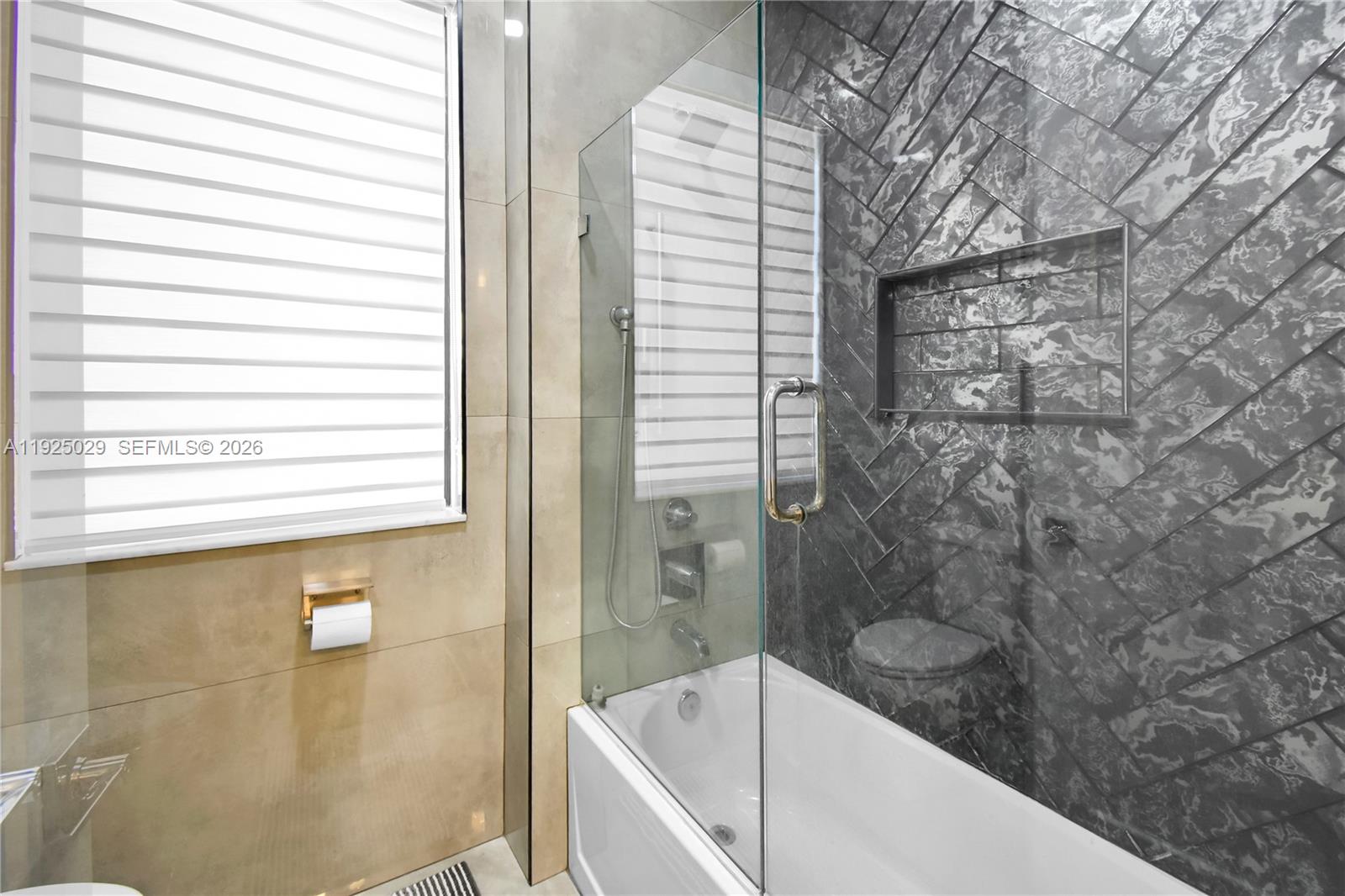 15846 Southwest 49th Street Southwest Ranches, FL 33331 - Photo 25 of 38 a bathroom with a bathtub and shower