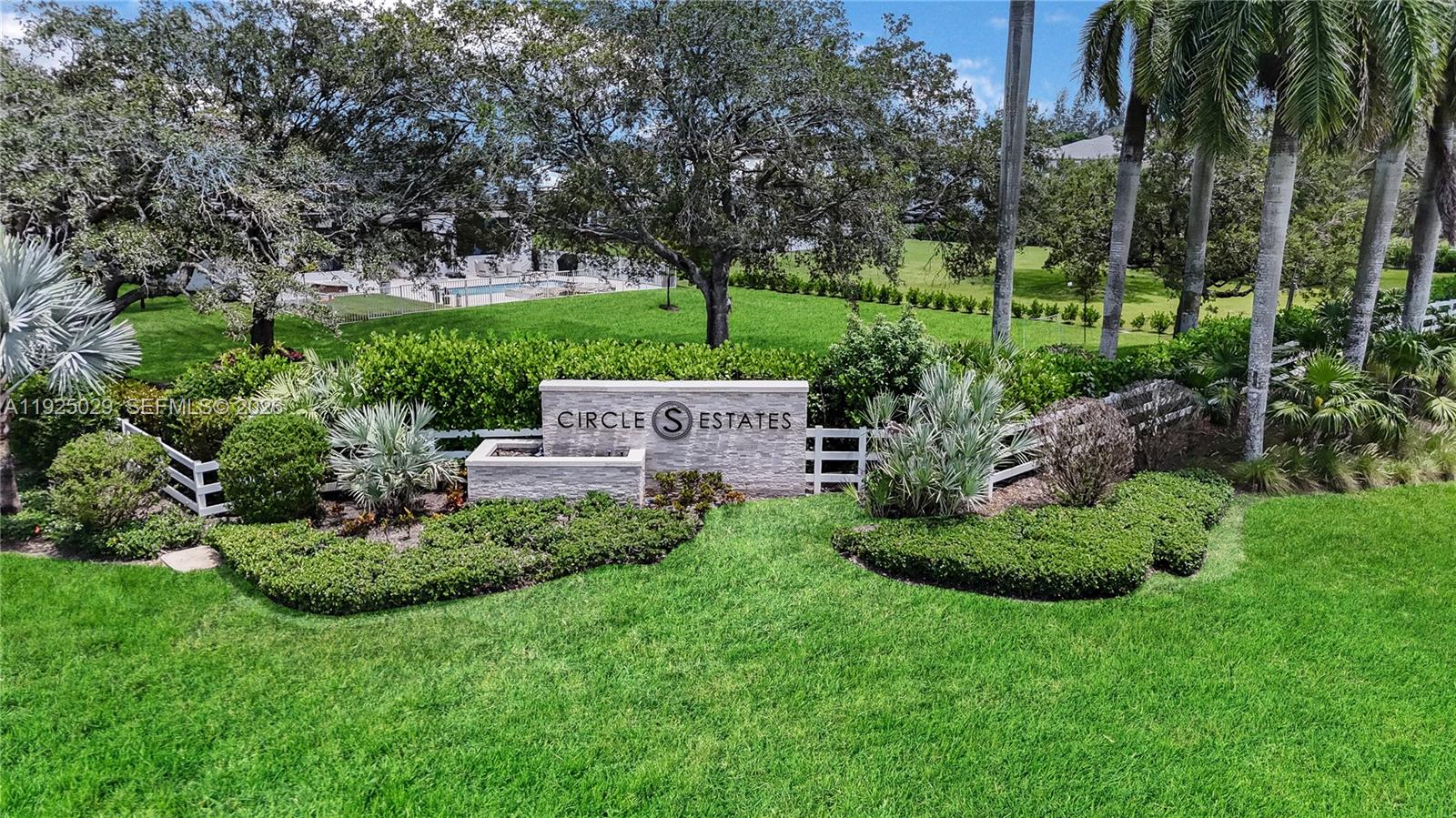 15846 Southwest 49th Street Southwest Ranches, FL 33331 - Photo 32 of 38 a front view of a house with a yard