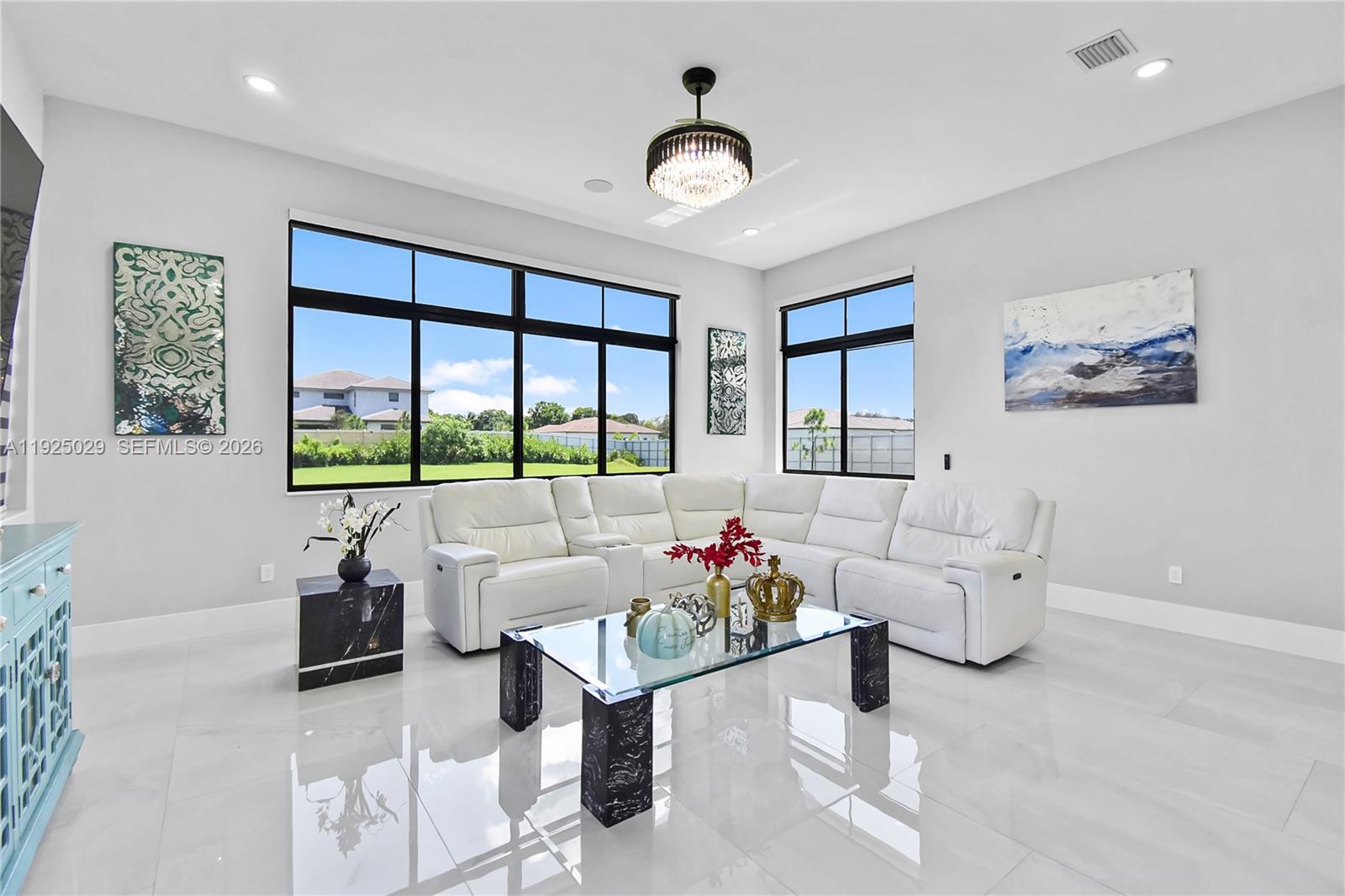 15846 Southwest 49th Street Southwest Ranches, FL 33331 - Photo 8 of 38 a living room with furniture and a large window
