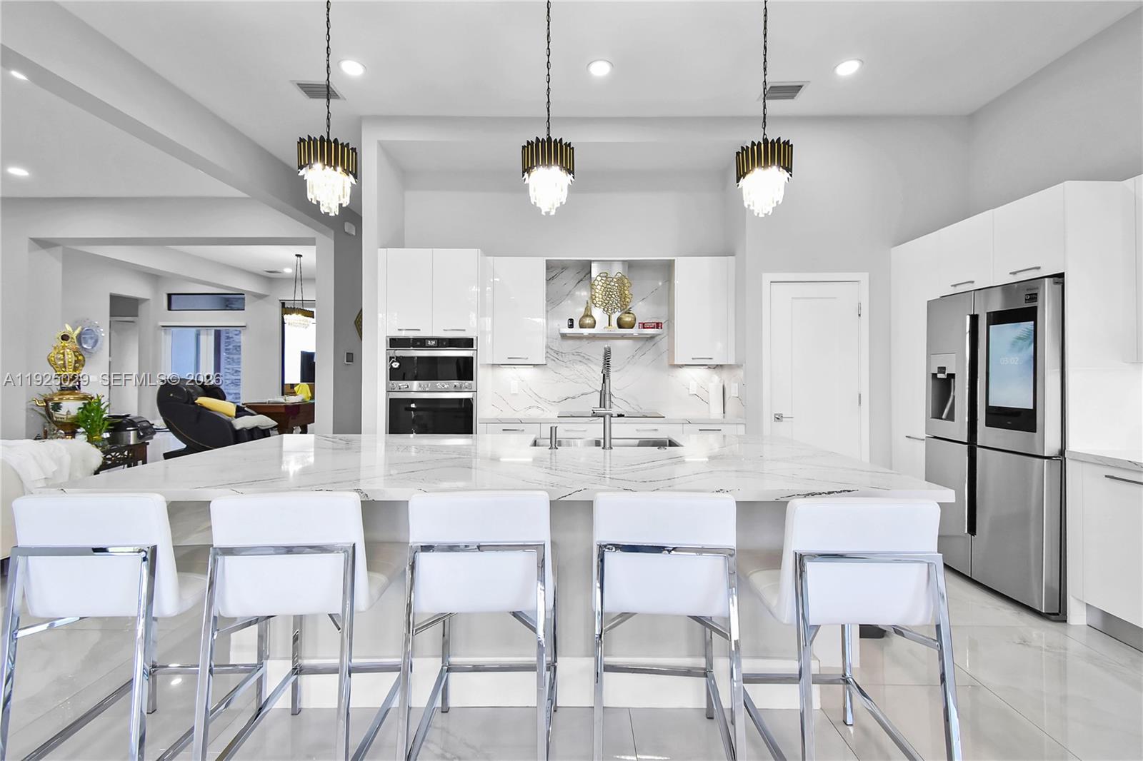 15846 Southwest 49th Street Southwest Ranches, FL 33331 - Photo 9 of 38 a kitchen with a dining table and chairs