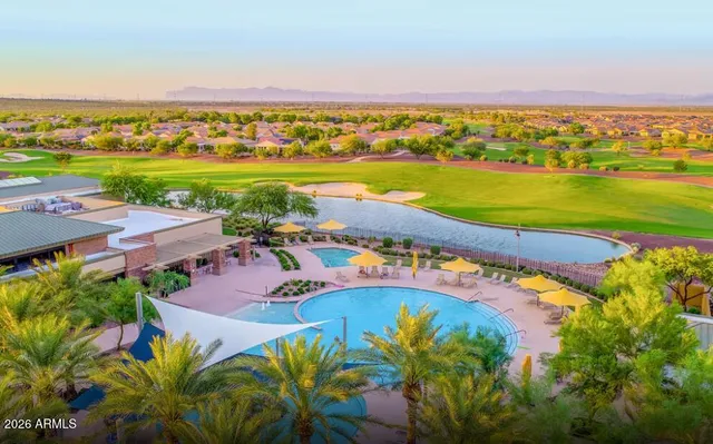 an aerial view of a city with a lake view