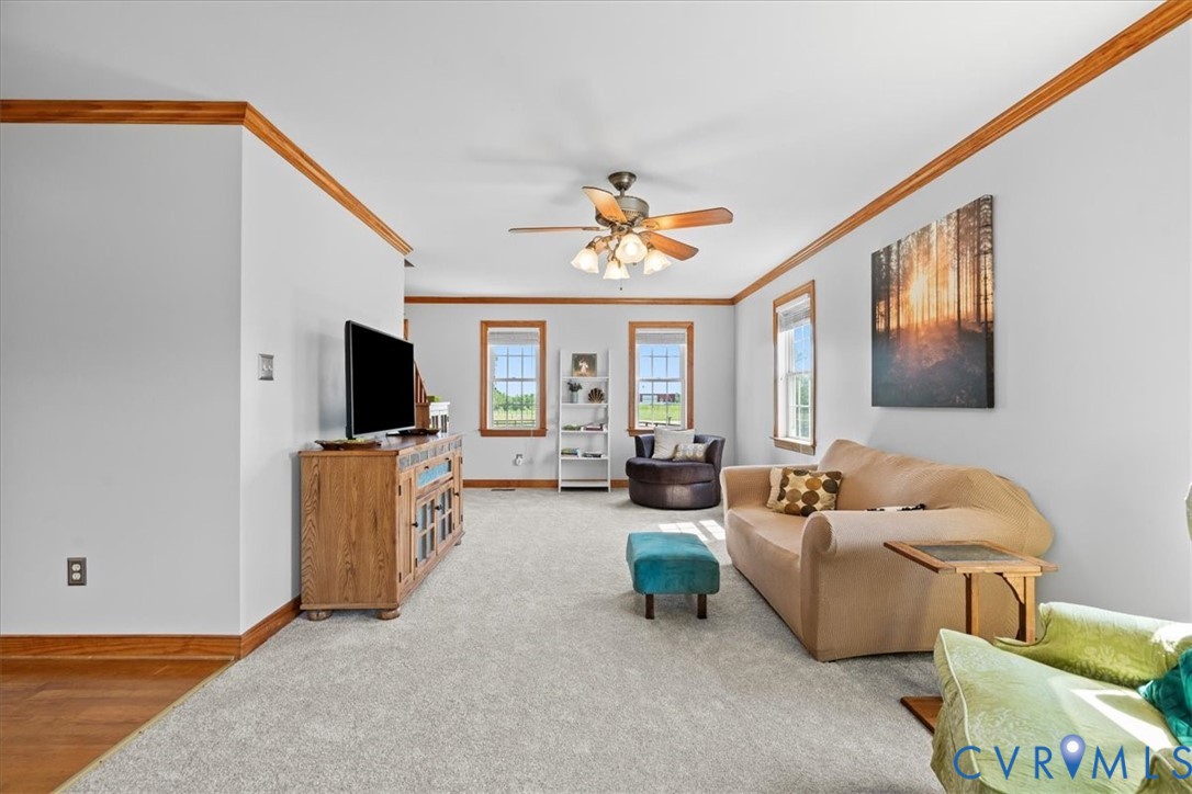 3137 Trenholm Road Powhatan, VA 23139 - Photo 12 of 72 a living room with furniture and a flat screen tv