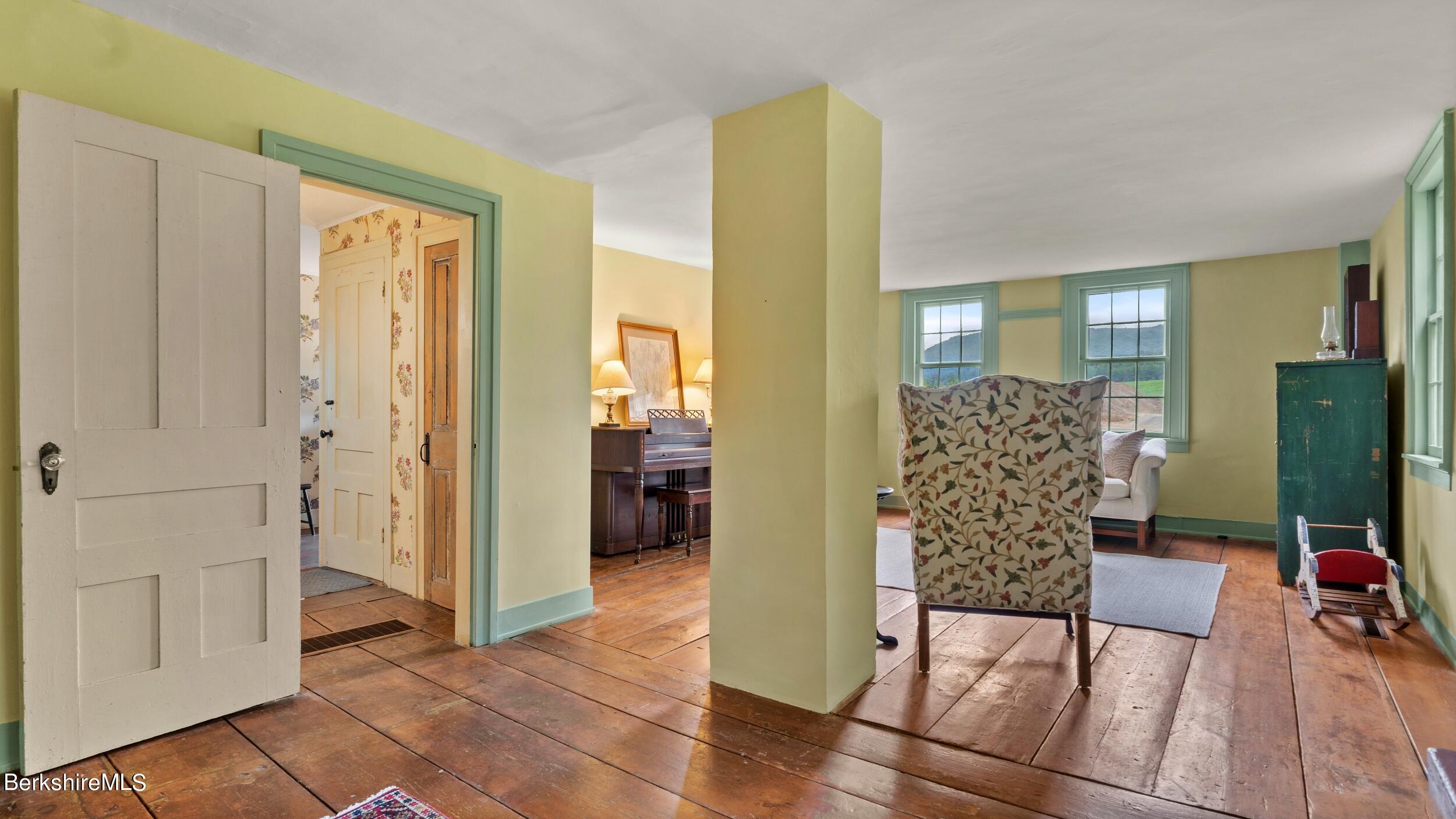 3 Church Road Tyringham, MA 01264 - Photo 7 of 53 a view of a livingroom with wooden floor and furniture