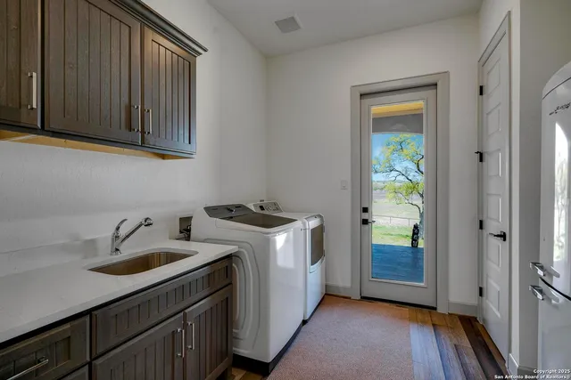 a bathroom with a sink toilet a mirror and shower