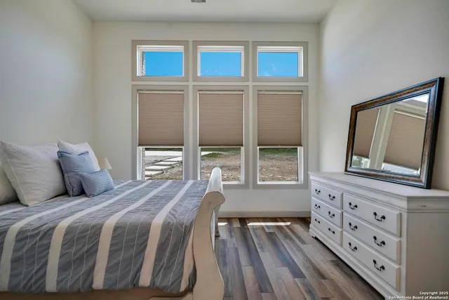 a bed room with a bed and a chandelier