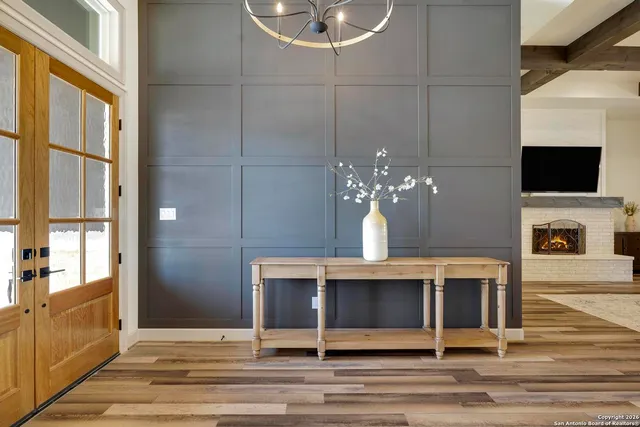 a view of a hallway view with wooden floor and staircase