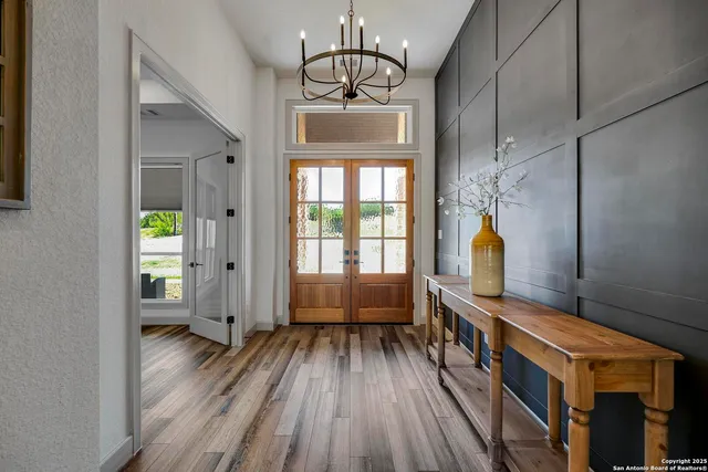a kitchen with granite countertop a sink cabinets and stainless steel appliances